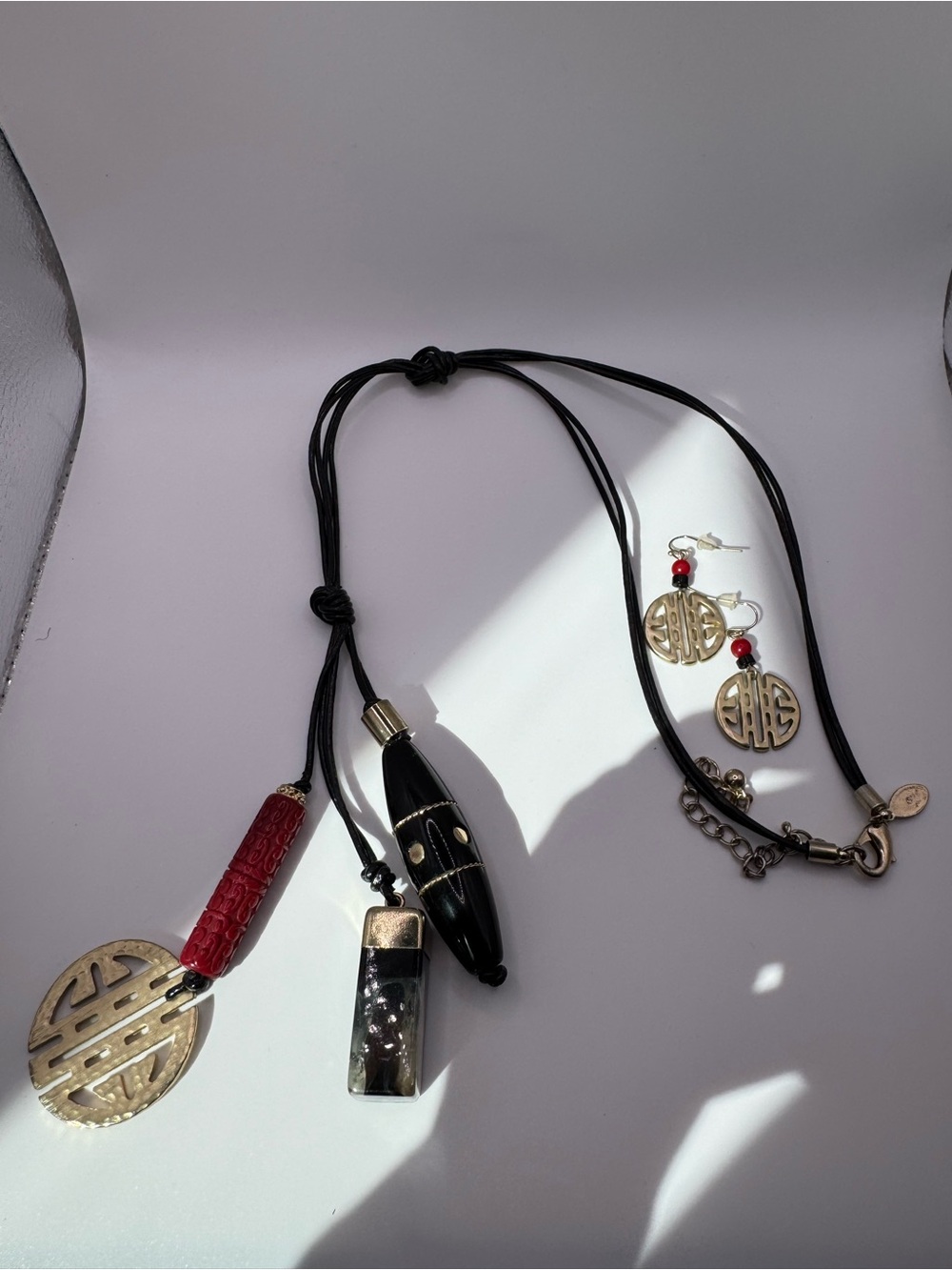 Chico's Black and Red Necklace with Coin Charm and matching earrings